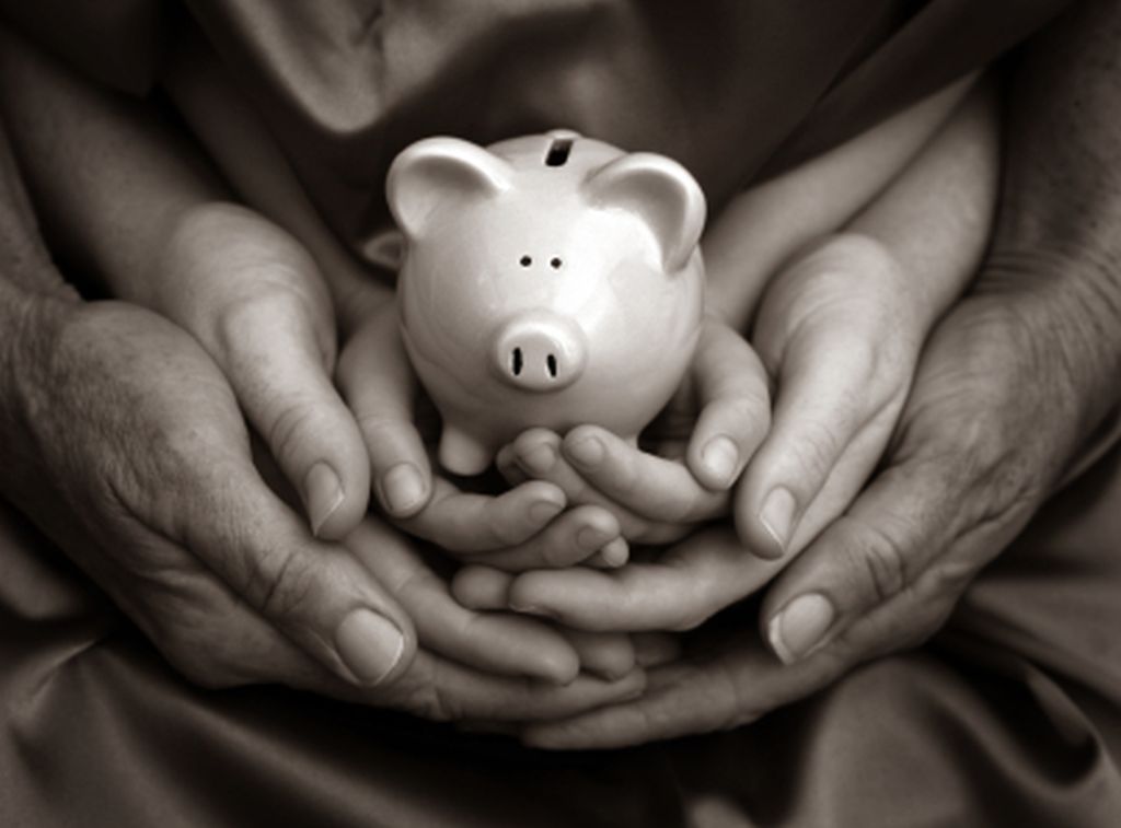 family-hands-piggy-bank